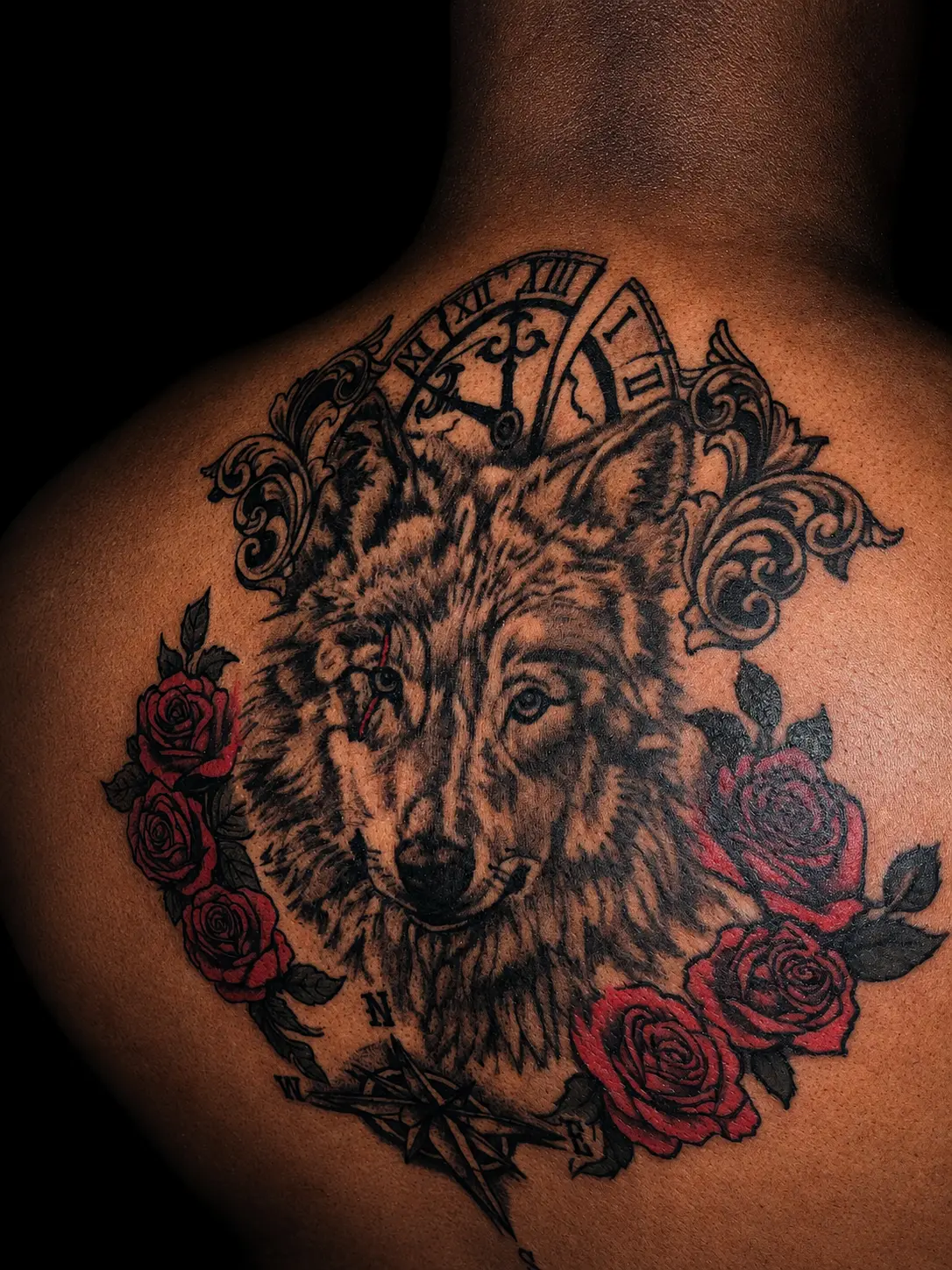 Wolf & Compass — Realism tattoo on back